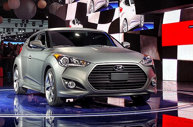 Купе Hyundai Veloster Turbo, модель 2013 года. Южнокорейская компания Hyundai продолжает завоевывать автомобильные рынки. На детройтском автосалоне она представила двухместное купе с новым турбо двигателем