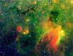 Туманность Змея рядом со сгустком межзвёздной пыли. Фотография сделана космическим телескопом «Спитцер» в инфракрасном диапазоне.