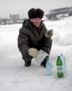 Председатель Яйского районного совета народных депутатов Николай Герасименко запасает святую воду для всего депутатского корпуса.