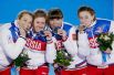 Женская сборная России по биатлону в составе Ольги Зайцевой, Яны Романовой, Екатерины Шумиловой и Ольги Вилухиной (слева направо) стала обладательницей серебряной медали женской эстафеты, состоявшейся на Олимпиаде в Сочи.