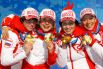 Российские биатлонистки Светлана Слепцова, Анна Богалий-Титовец, Ольга Медведцева и Ольга Зайцева (слева направо), завоевавшие золотые медали в женской эстафетной гонке 4х6 км на XXI зимних Олимпийских играх, во время церемонии награждения. 2010 год.