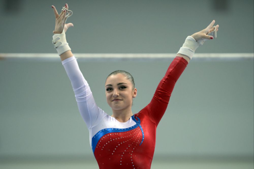 Алия Мустафина — российская гимнастка. Олимпийская чемпионка 2012 года в упражнении на брусьях, серебряный и двукратный бронзовый призёр Олимпиады 2012 года. Трёхкратная чемпионка мира, трехкратная чемпионка Европы, многократный призер чемпионатов мира и Европы. Спортсменка года-2012 в России.