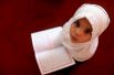 5 июля, Ливия. Девочка читает Коран в школе во время священного для мусульман месяца Рамадан.