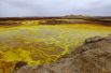 На территории впадины Данакиль расположен вулкан, известный своими внеземными пейзажами, напоминающими поверхность Ио, спутника Юпитера. В 1926 году при сильном взрыве образовалось крупное озеро, расположенное на высоте 48 метров ниже уровня моря. Окраска озера фиолетово-жёлтого цвета.