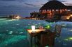 Сказочный вид на океан из бассейна при Huvafen Fushi Resort and Spa на Мальдивах