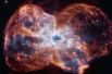 Гибель звезды солнечного типа. Звезда заканчивает свою жизнь, сбрасывая внешние слои газа, которые образуют кокон вокруг оставшегося ядра.