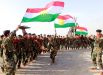 Бойцы курдских сил Пешмерга празднуют приход весны и нового года в Киркуке, Ирак.