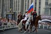 Всадники Кремлевской школы верховой езды во время праздника в честь Дня России. 