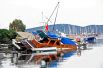 Затопленные лодки после землетрясения и цунами в курортном городе Гюмбет в провинции Мугла в Турции.
