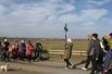 На мосту через реку встречают жители села Иваненково