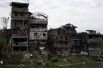 Разрушенные жилые дома и здания города после окончания военной операции.