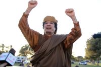 Муаммар Каддафи.