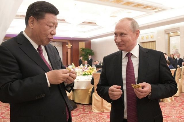Си Цзиньпин и Владимир Путин. Фото: Алексей Дружинин