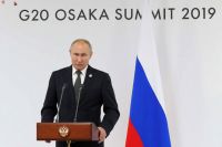 Президент РФ Владимир Путин на пресс-конференции по итогам саммита «Группы двадцати» в международном выставочном центре INTEX Osaka.