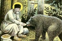 Серафим кормит медведя. Фрагмент литографии Путь в Саров, 1903 год.