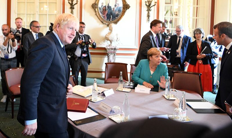 Премьер-министр Великобритании Борис Джонсон, президент Франции Эммануэль Макрон и канцлер Германии Ангела Меркель.