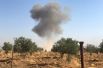 Поднимающийся дым в деревне Тель-Аркам в окрестностях города Рас-эль-Айн в Сирии.
