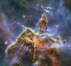 «Мистическая гора» внутри туманности Киль. Эта космическая вершина высотой в три световых года состоит из пыли и газа и имеет признаки интенсивного звездообразования. Снимок 2010 года.