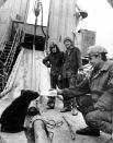 Рабочие буровой бригады во время кормления медвежонка молоком из бутылки. 1980 год.