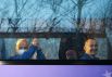 Члены основного экипажа МКС-65 астронавт НАСА Марк Ванде Хай, космонавты Роскосмоса Олег Новицкий и Пётр Дубров (слева направо) в автобусе перед запуском пилотируемого корабля.