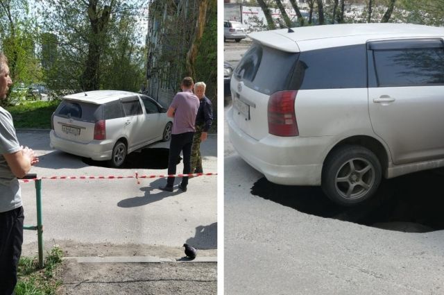 Асфальт провалился под автомобилем на улице Дачной в Новосибирске