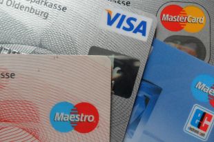 АМКУ разрешил Visa и Mastercard снизить межбанковскую комиссию: причина