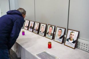 Портреты погибших при аварии на шахте