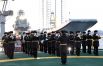 Выступление военного оркестра на торжественной церемонии поднятия государственного флага РФ на первом серийном универсальном атомном ледоколе «Сибирь» проекта 22220 в Мурманске