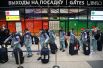 Члены олимпийской сборной России в аэропорту Шереметьево перед отправлением в Пекин для участия в XXIV Олимпийских зимних играх