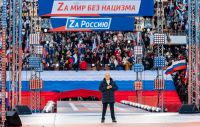 Президент РФ Владимир Путин на концерте-митинге в «Лужниках» в честь годовщины воссоединения Крыма и Севастополя с Россией.