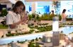 Девушка фотографирует макет развития района Павелецкая ГК «Пионер» на выставке ключевых градостроительных и инфраструктурных проектов Москвы «Город для каждого» в ЦВЗ «Манеж»