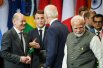 Канцлер Германии Олаф Шольц, президент Франции Эммануэль Макрон Джо Байден, президент Соединенных Штатов Америки США, и Нарендра Моди, премьер-министр Индии.