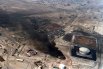 Разрушенное хранилище нефти во время операции «Буря в пустыне».
