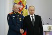 Младший сержант Дмитрий Еремин и президент РФ Владимир Путин.
