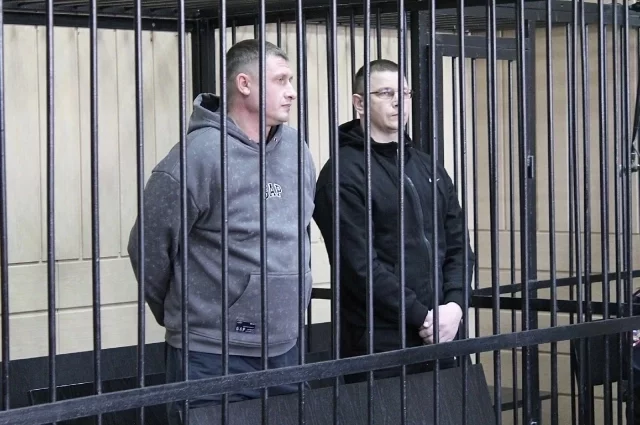 На скамье подсудимых экс-полицейские Максим Кудрявцев и Евгений Бартоломей.