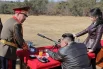 Лидер КНДР Ким Чен Ын с дочерью Ким Чжу Э вместе с членами делегации посетили стрельбище.