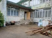 На территории садика есть нсколько выходов, рядом с которыми валяются гнилые доски; есть вопросы к тому, не мешают ли они детям на прогулке.