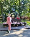 Памятник поэту утопает в цветах. 