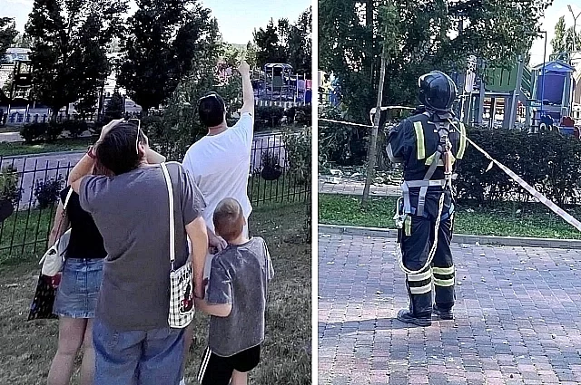 Местные жители смотрят, как на месте ЧП спасатели разбирают завалы.